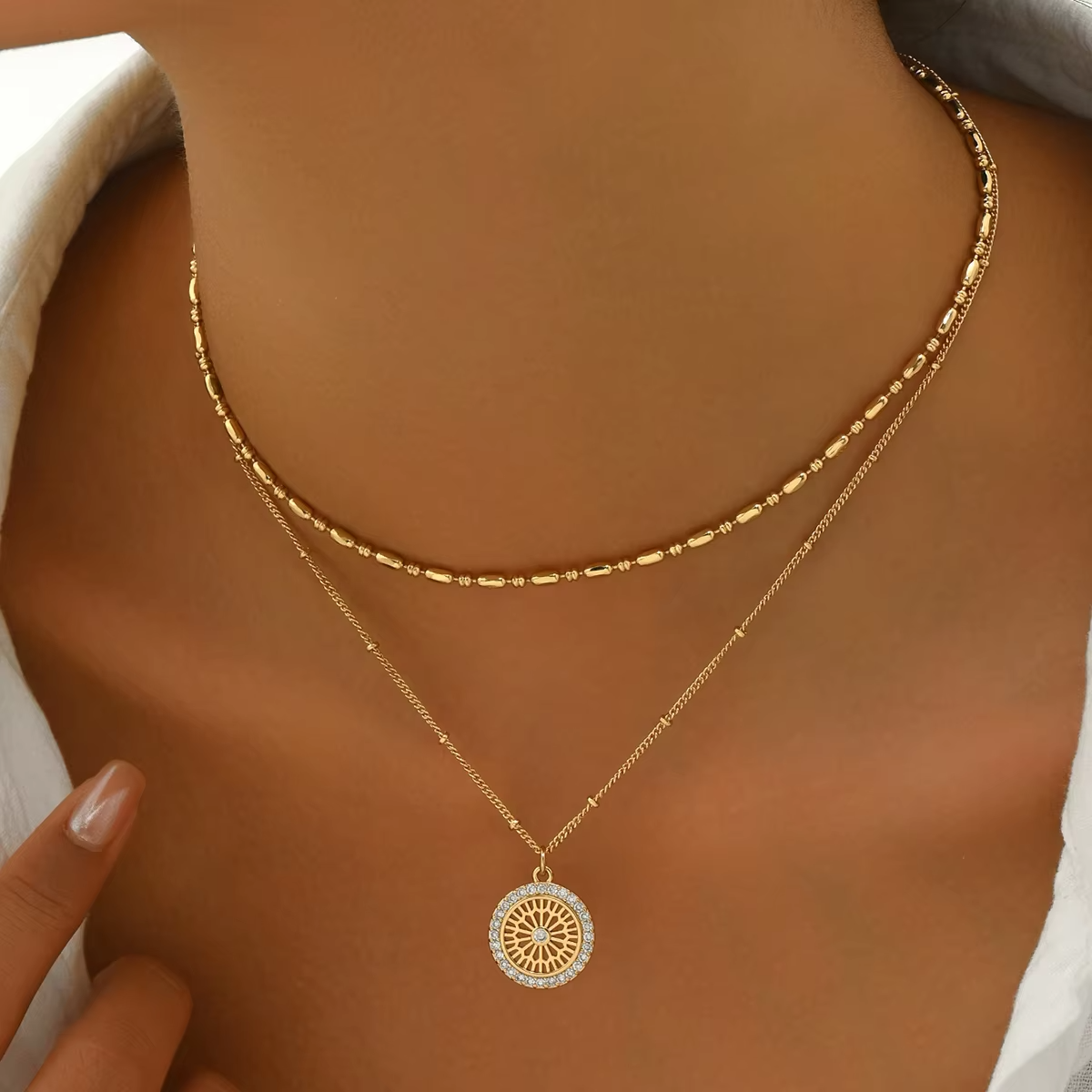 Elegant Gold Layered Necklace Set with Crystal Medallion Pendant - Image 3